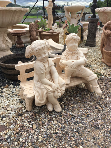 Boy and girl on the seat statue
