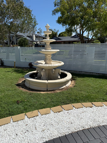 4 tier quarter horse fountain with traditional acorn in traditional pond surround