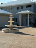 4 tier Italian fountain with traditional acorn and traditional pond surround