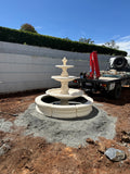 3 tier Italian with traditional pond surround and traditional acorn on smooth base fountain