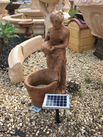 Pourer lady at bucket fountain