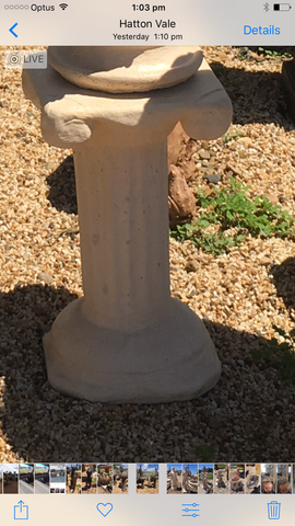 Scroll pedestal statue