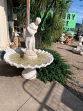 Pourer lady on scollup fountain