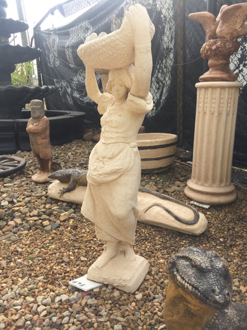 Tall basket carrying lady statue