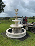 Quarter horse fountain with doves and traditional pond surround